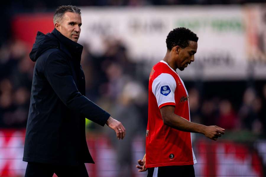 Feyenoord manager Robin van Persie (L) looks dejected after the Eredivisie game against FC Twente