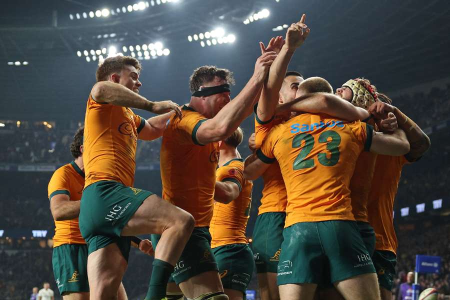 Max Jorgensen celebrates with teammates after scoring their late winning try against England