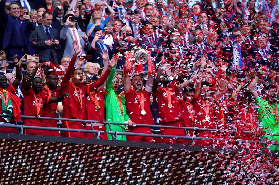 Henderson celebrates winning the FA Cup with Liverpool last season