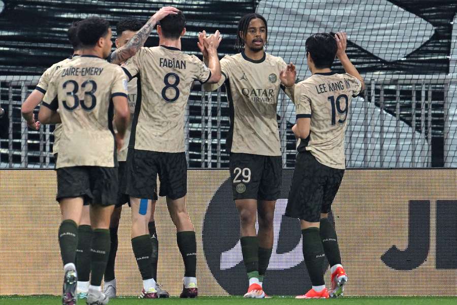 PSG players celebrate their first goal of the evening