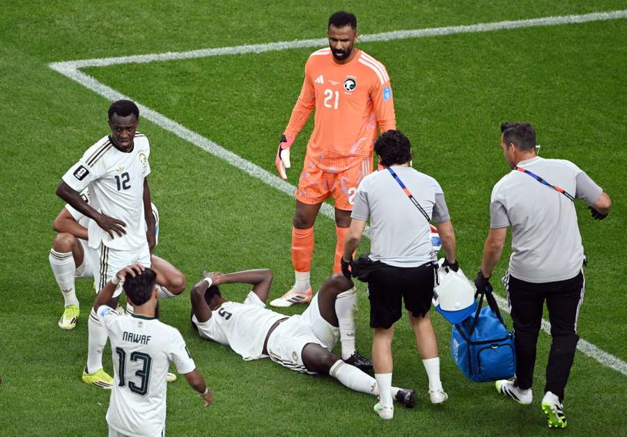 Hassan Altambakti receives medical attention after sustaining an injury.