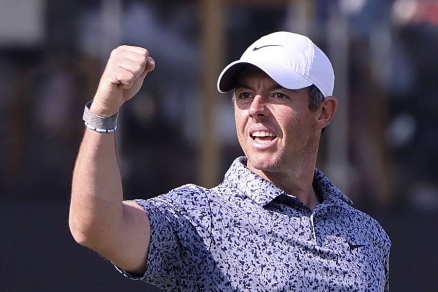 McIlroy remains world number one after beating bitter rival Reed in Dubai