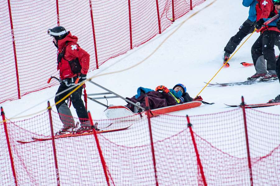 Mikaela Shiffrin is taken away by ski patrol medics in a sled after crashing in the 2024/2025 Women's World Cup Giant Slalom