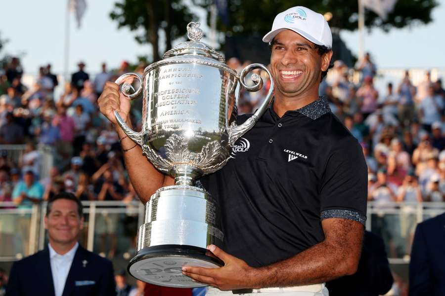 Aaron Rai poses with the PGA Championship trophy after winning his first-ever major. Aaron Rai poses with the PGA Championship trophy after winning his first-ever major.