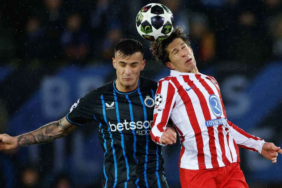 Club Brugge's Aleksandar Stankovic in action with Atletico Madrid's Giuliano Simeone Club Brugge's Aleksandar Stankovic in action with Atletico Madrid's Giuliano Simeone