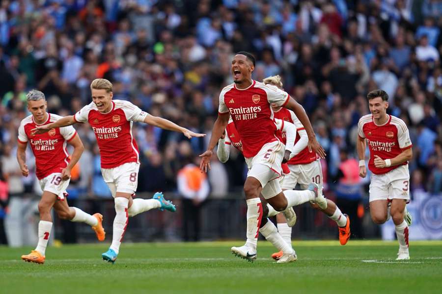 Arsenal's William Saliba and team-mates celebrate after winning the penalty shoot-out