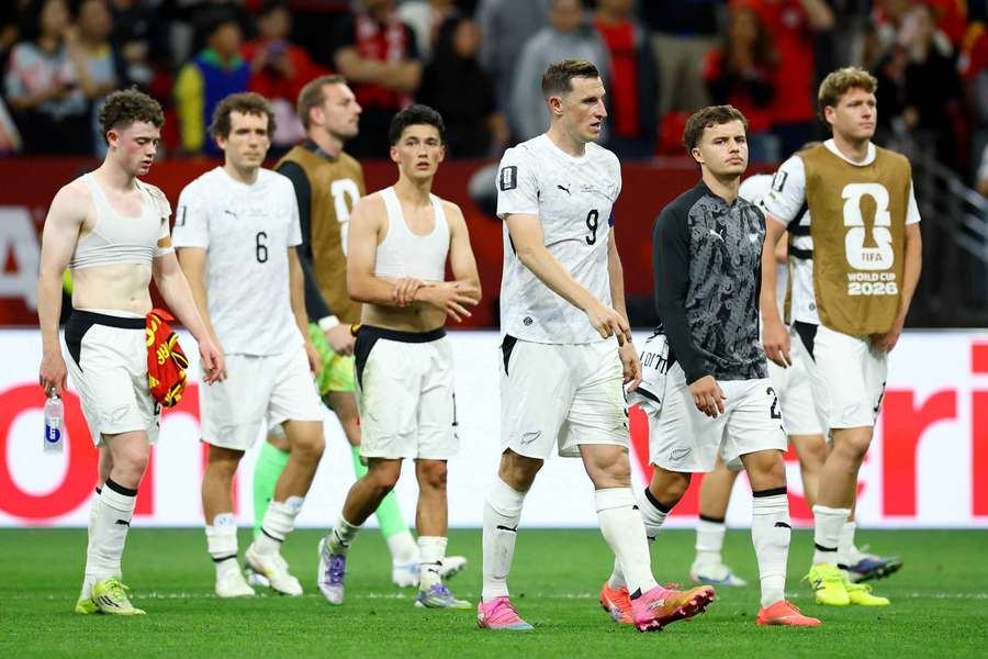 New Zealand's Chris Wood and teammates look dejected after the match as New Zealand are eliminated from the World Cup.