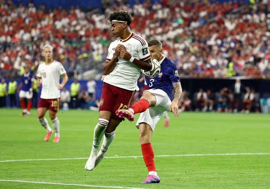 France's Lucas Digne concedes a penalty against Lamine Yamal