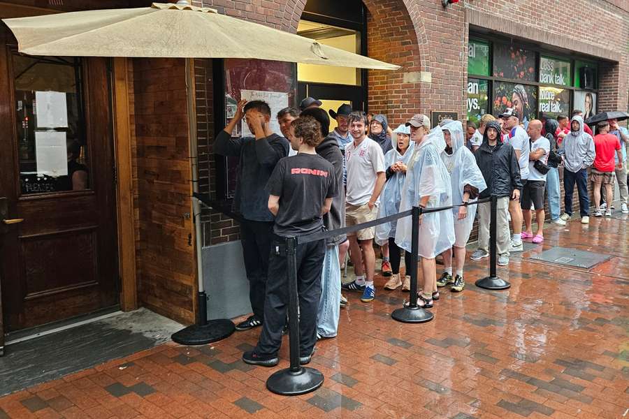 Long queues formed outside bars in the city despite the thundery conditions Long queues formed outside bars in the city despite the thundery conditions