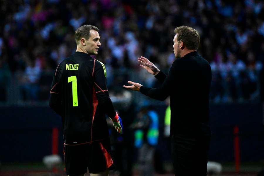 Germany legend Manuel Neuer speaks with manager Julian Nagelsmann