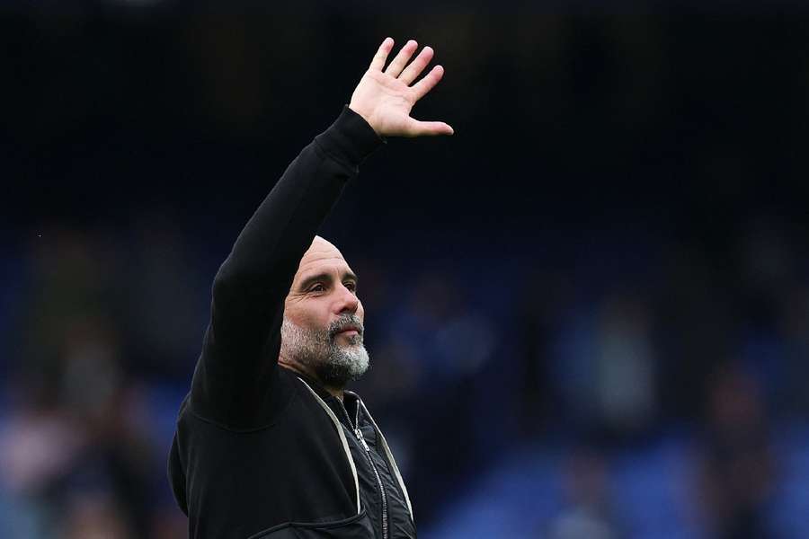 Guardiola celebrating win vs Everton with the away fans