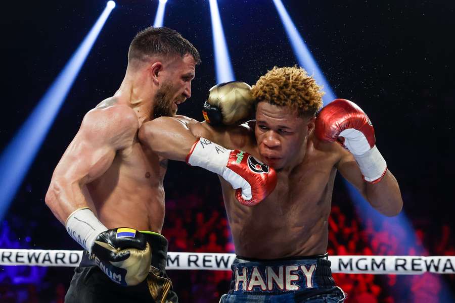 Devin Haney exchanges punches with Vasyl Lomachenko