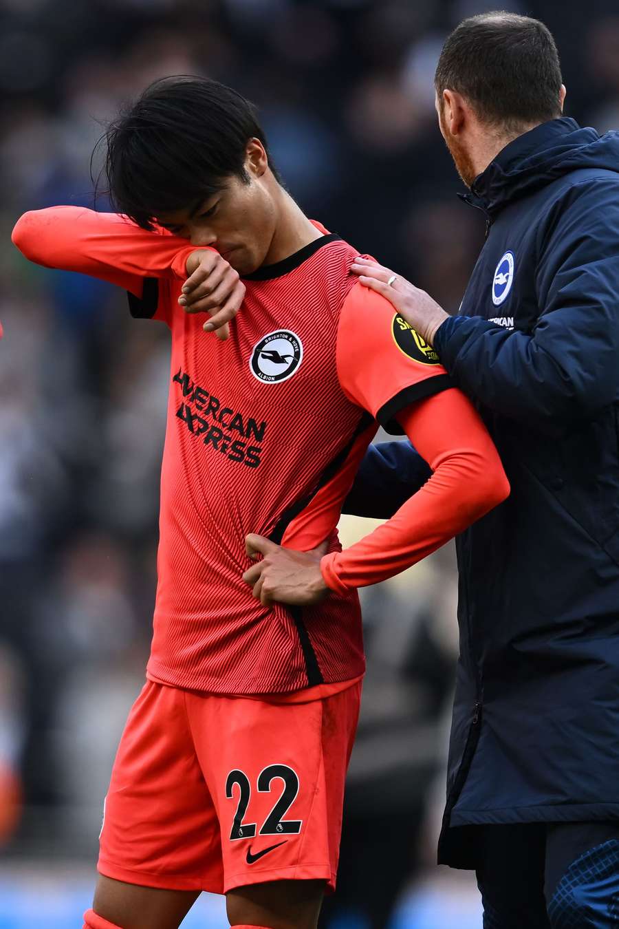 Japanese midfielder Kaoru Mitoma reacts to his side's defeat on the pitch after the English Premier League football match between Tottenham Hotspur and Brighton