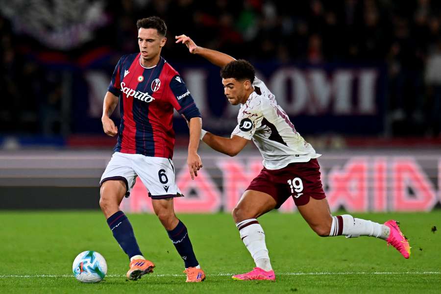 Nikola Moro and Torino forward Che Adams battle for the ball Nikola Moro and Torino forward Che Adams battle for the ball