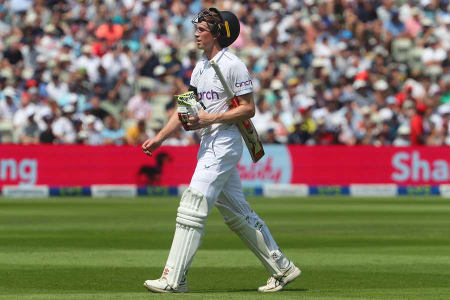 Zak Crawley reacts as he walks back to the pavilion after losing his wicket for 61