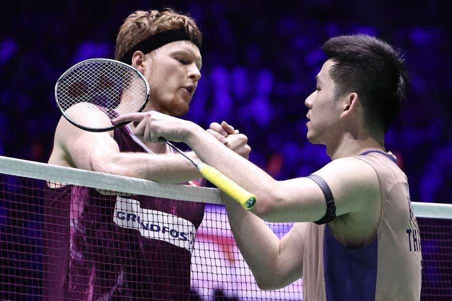 Thailand's Kunlavut Vitidsarn (R) is congratulated by Denmark's Anders Antonsen at the French Open