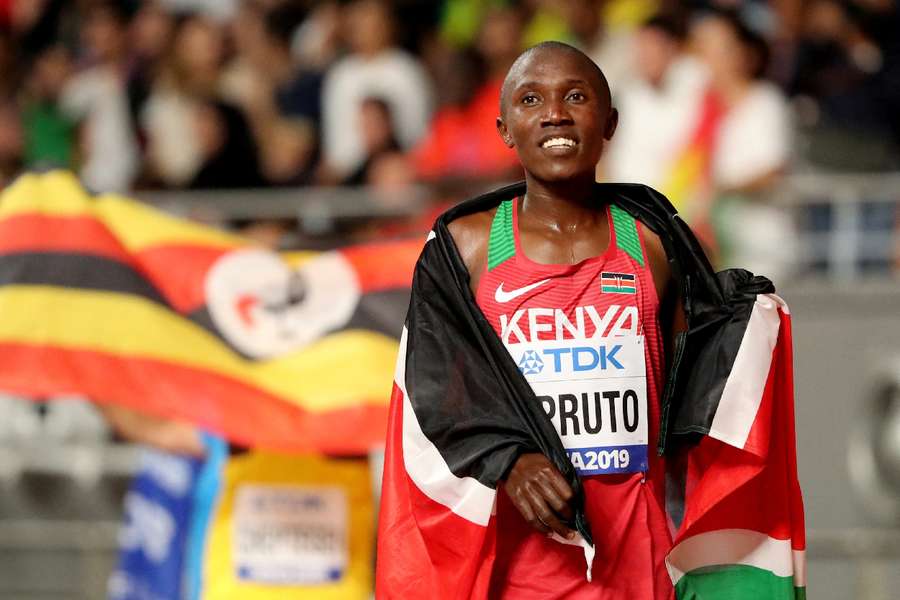 Kenya's Rhonex Kipruto celebrates winning bronze at the World Championships in 2019