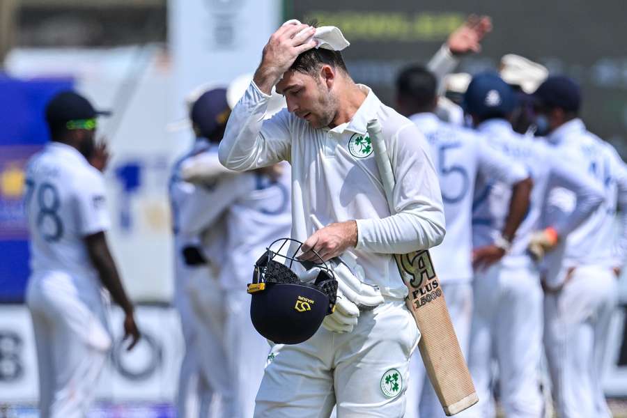 Ireland's Curtis Campher walks back to the pavilion after his dismissal