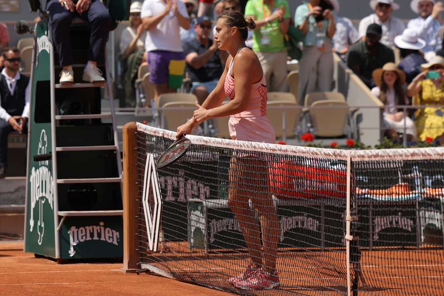 Sabalenka approaches the net after her win against Svitolina