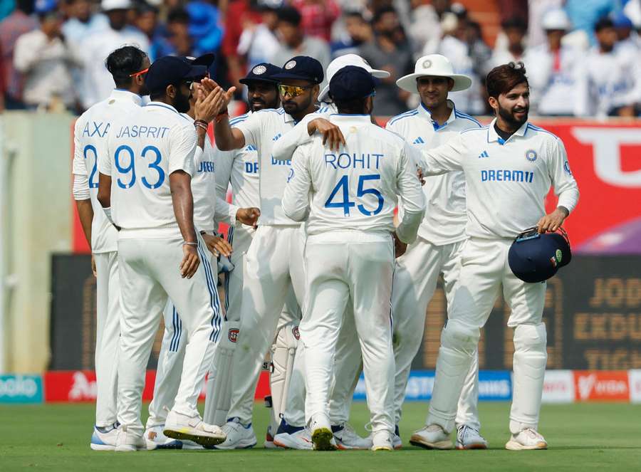 India's Shreyas Iyer celebrates with teammates after taking a catch to dismiss England's Zak Crawley off the bowling of Axar Patel