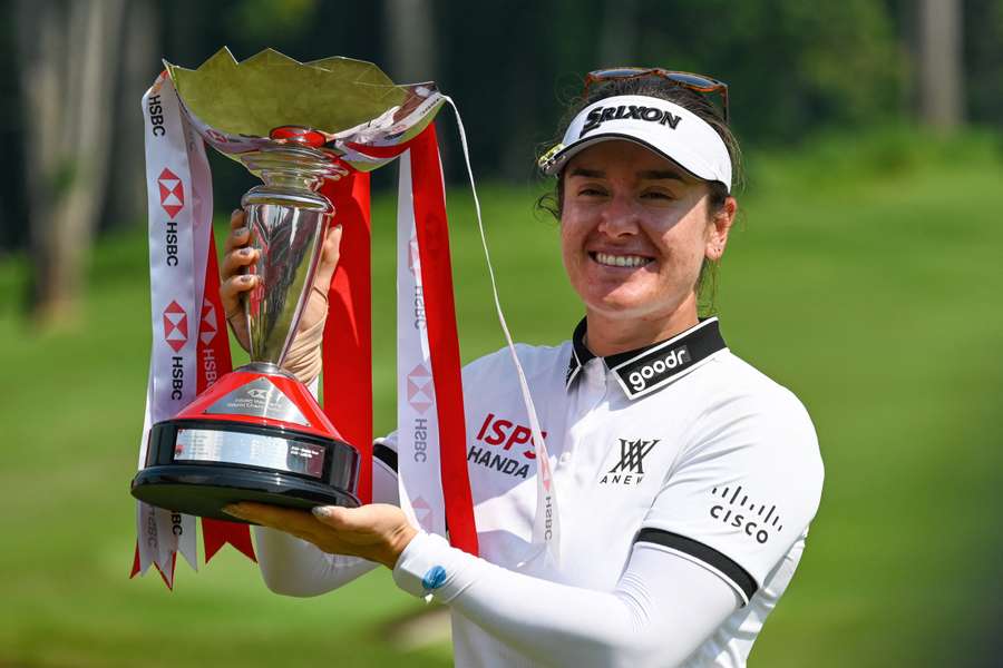 Hannah Green celebrates with the trophy after winning the HSBC Women's World Championship Hannah Green celebrates with the trophy after winning the HSBC Women's World Championship