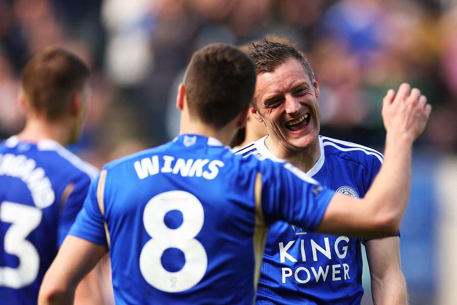 Jamie Vardy of Leicester City celebrates scoring his team's third goal with teammate Harry Winks
