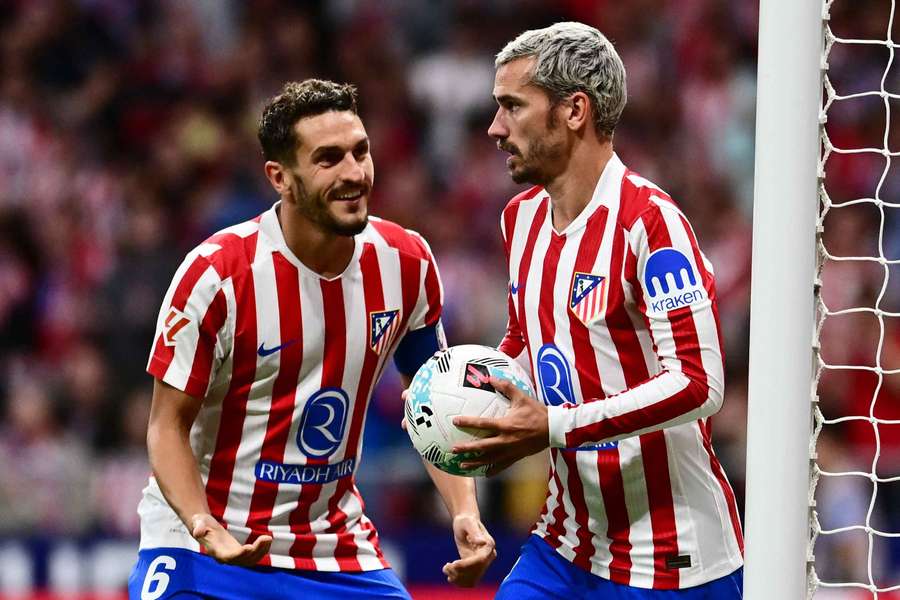 Atletico Madrid's Antoine Griezmann celebrates scoring with Koke