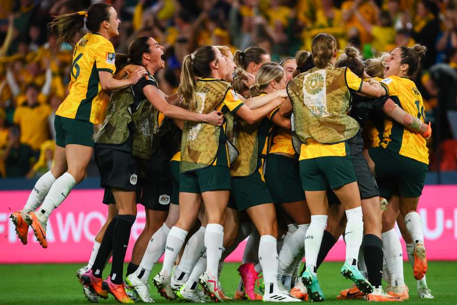 Australia celebrate as they setup a World Cup semi-final clash against England