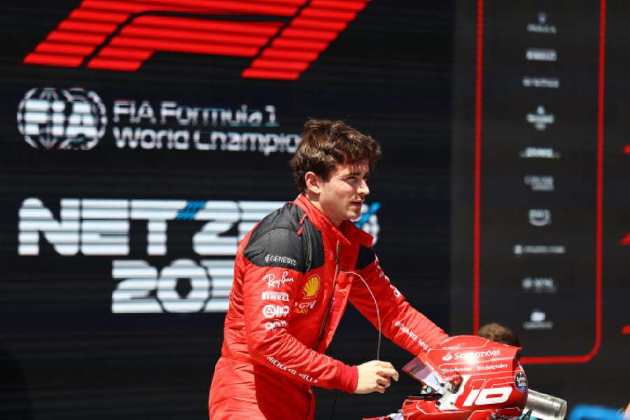 Charles Leclerc reacts after taking the sprint poll 