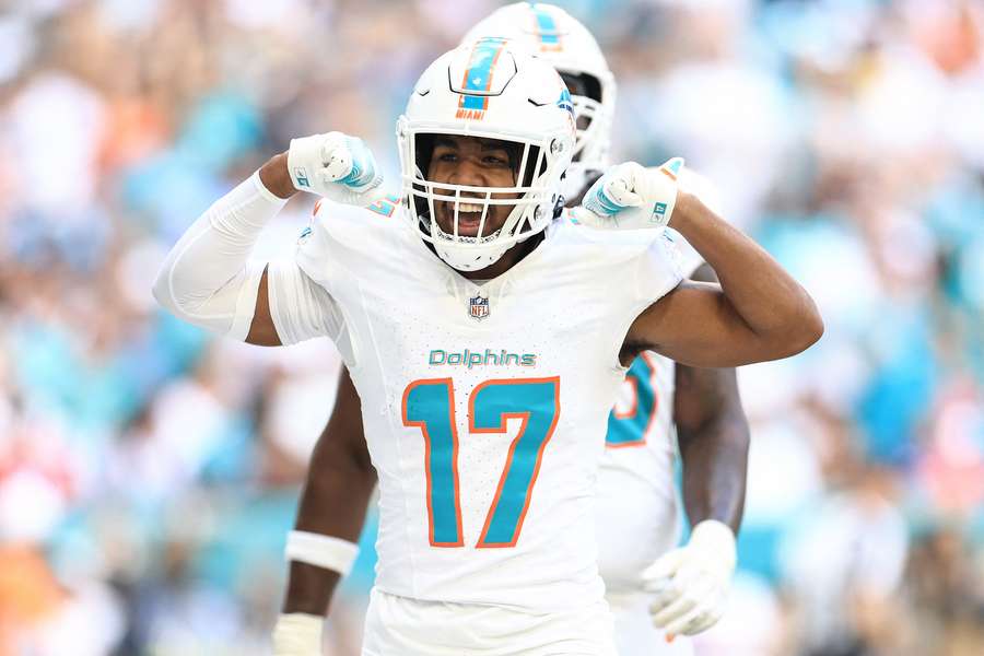 Jaylen Waddle celebrates after a touchdown