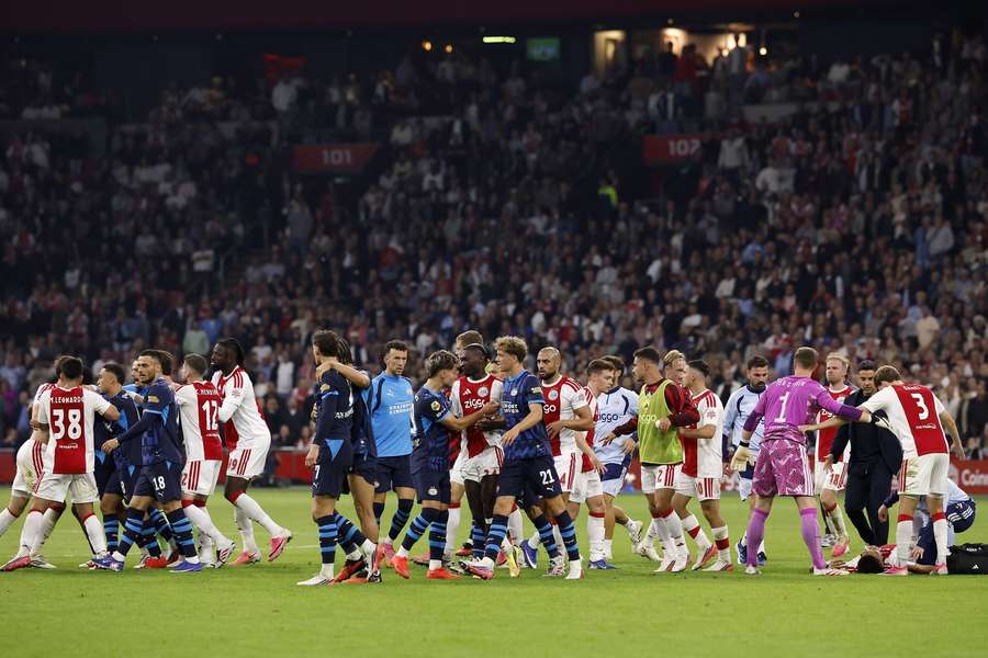 Ajax and PSV are involved in a scuffle after Van Bommel's charge on Bouwman