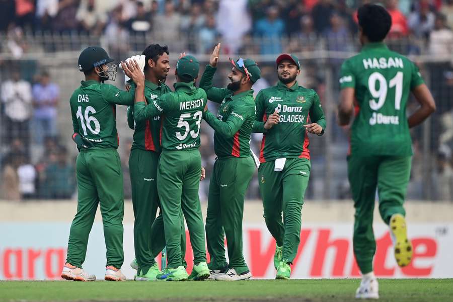 The Bangladesh players celebrate against England