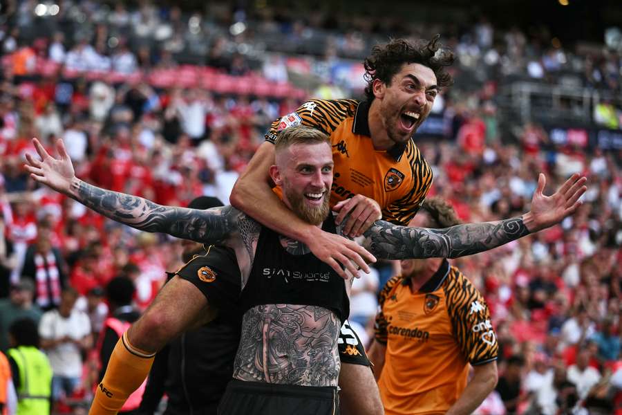 Oliver McBurnie celebrates scoring deep into injury time for Hull Oliver McBurnie celebrates scoring deep into injury time for Hull