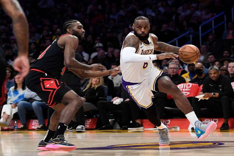 James (R) bursts past Patrick Williams of the Chicago Bulls