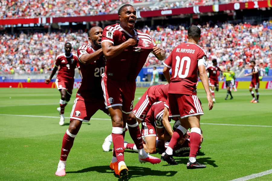 Pedro Miguel and Ahmed Fathy celebrate after Boualem Khoukhi scored Qatar's equalising goal in the 95th minute Pedro Miguel and Ahmed Fathy celebrate after Boualem Khoukhi scored Qatar's equalising goal in the 95th minute