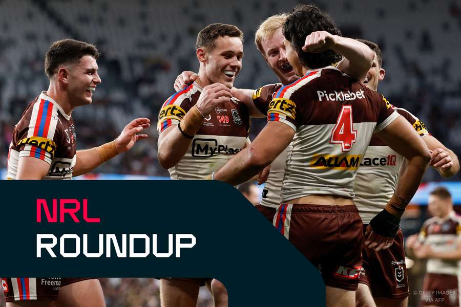 Casey McLean and teammates celebrate a try scored against Wests Tigers. 