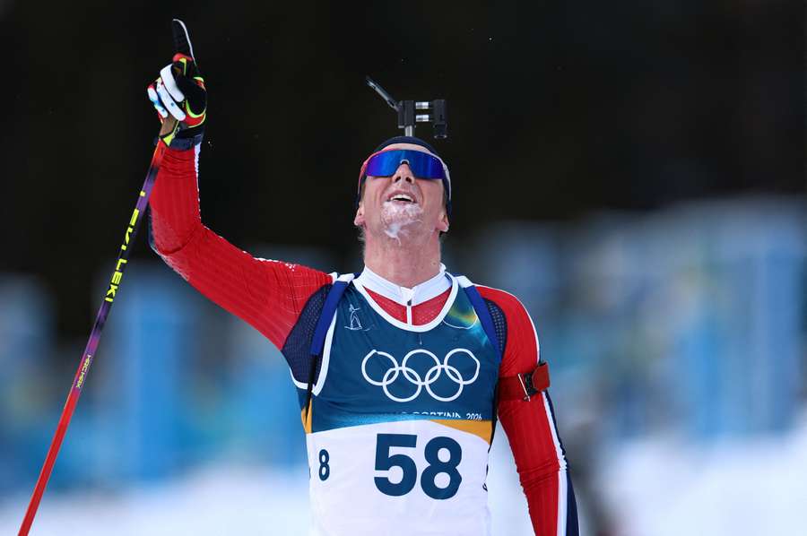 Johan-Olav Botn of Norway reacts after crossing the line