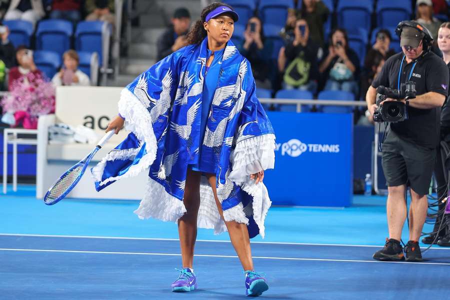 Naomi Osaka donning her crange outfit in Tokyo Naomi Osaka donning her crange outfit in Tokyo