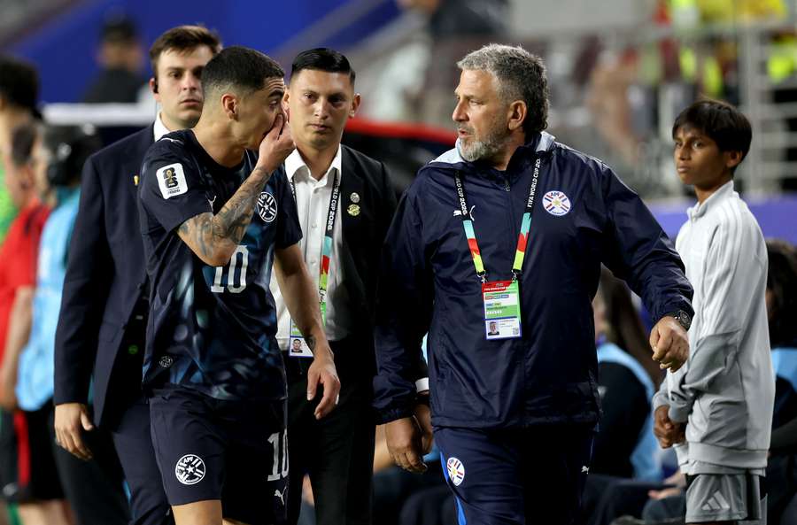 Almiron explains his red card to team management. Almiron explains his red card to team management.