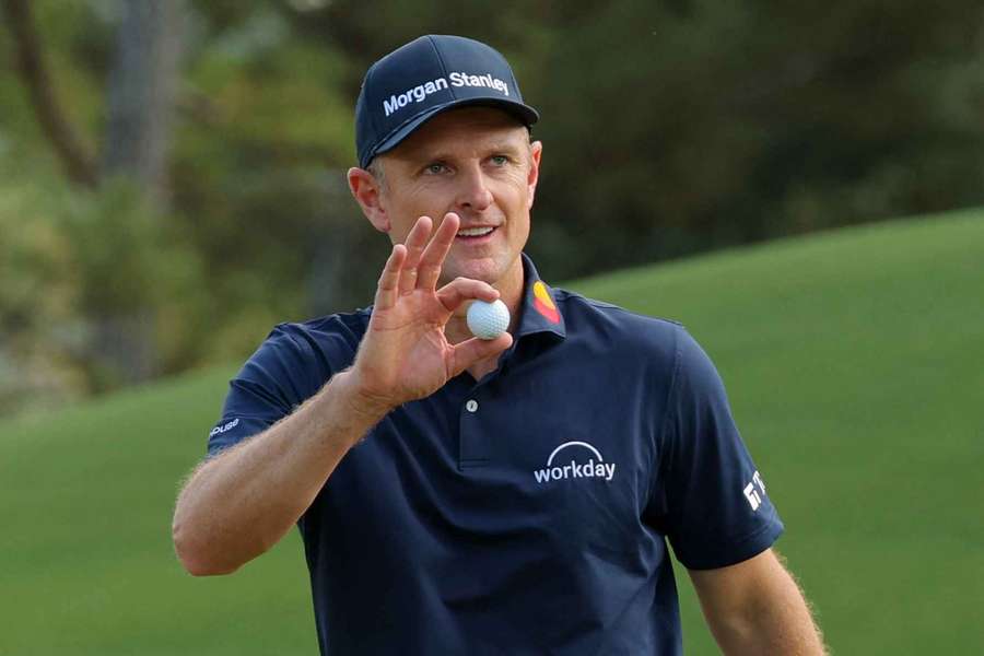England's Justin Rose acknowledges the crowd after holing a birdie putt on the 8th hole during the final round