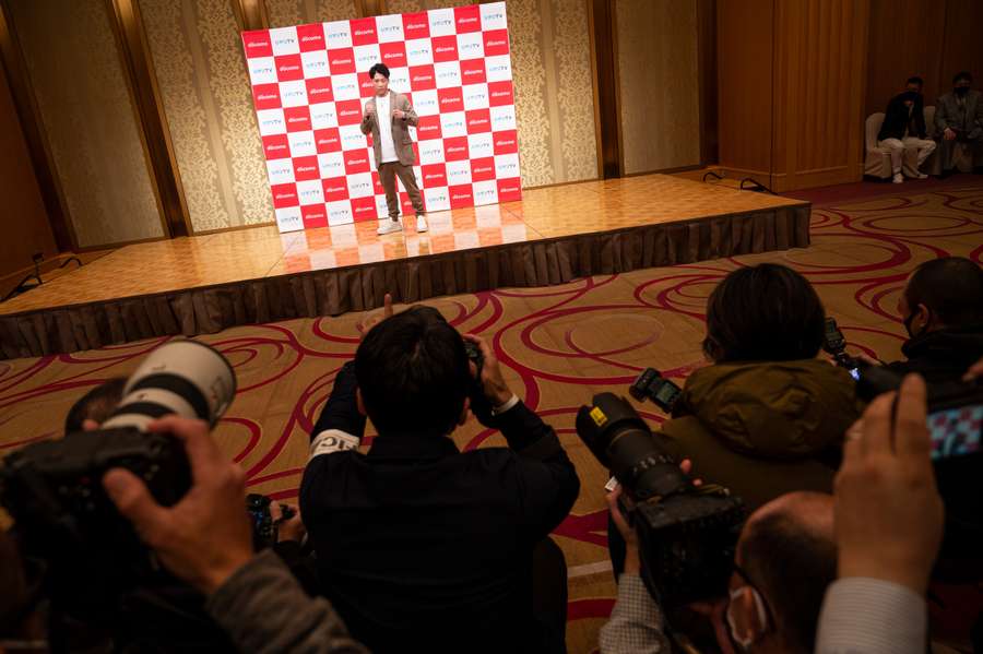 Boxer Naoya Inoue poses for photographs during a press conference in Yokohama