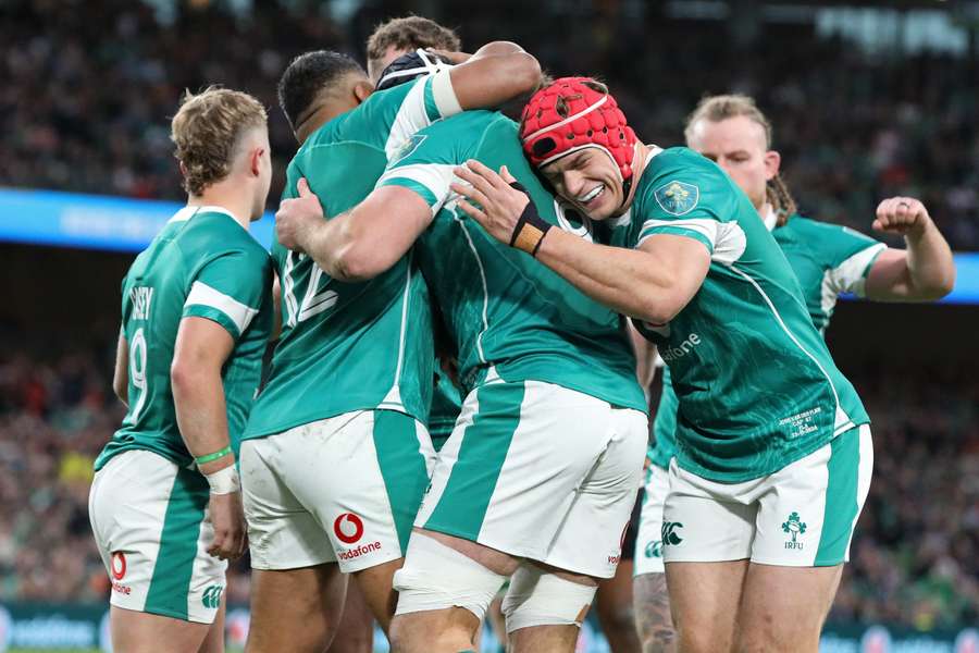 Ireland's Caelan Doris (C) celebrates with teammates