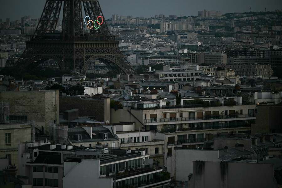 This photograph taken from the Arc de Triomphe shows the Eiffel Tower with the Olympic Rings during the Paris 2024 Paralympic Games Opening Ceremony