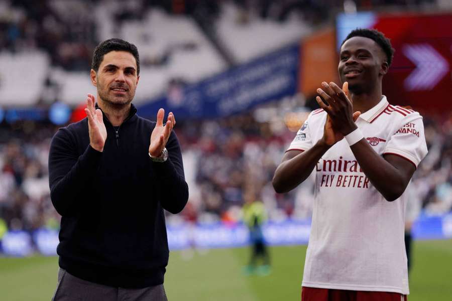 Mikel Arteta and Bukayo Saka celebrate one of Arsenal's wins.