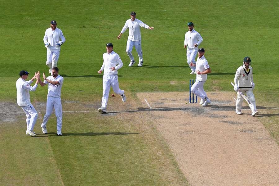 England's players congratulate Woakes