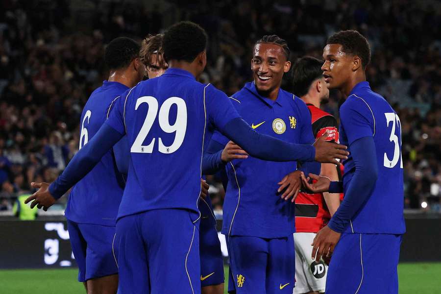 Chelsea's Joao Pedro celebrates scoring their sixth goal with teammates