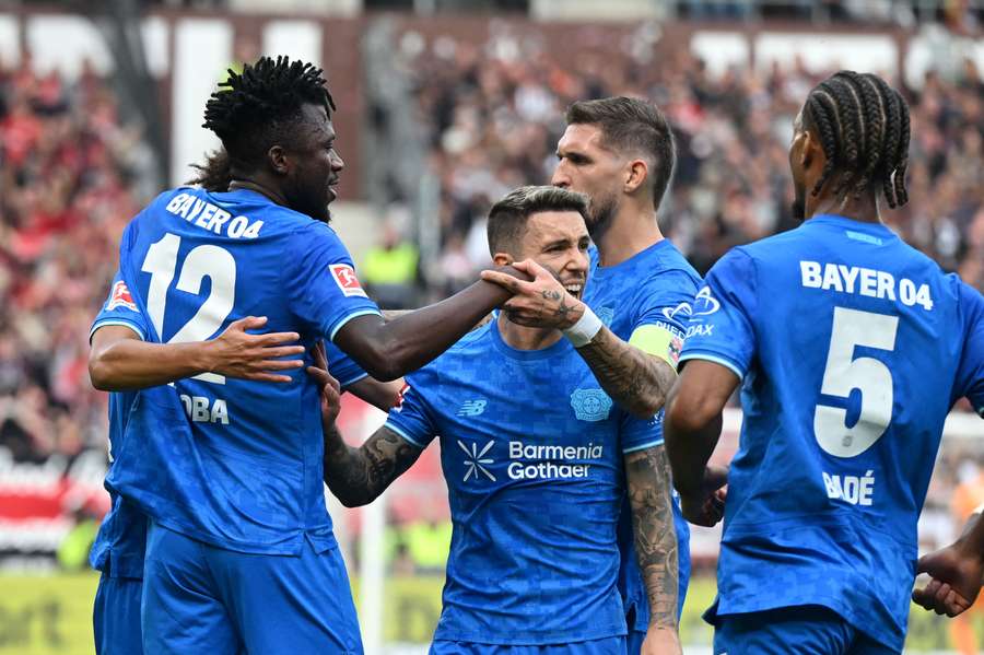 Leverkusen players celebrate their opening goal against St. Pauli