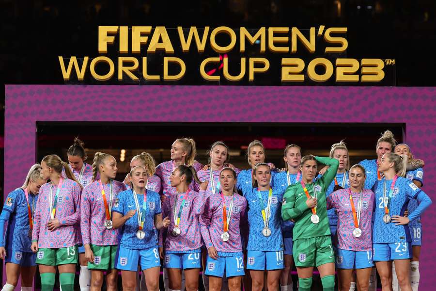 England's players stand on the podium after receiving the runners up medals