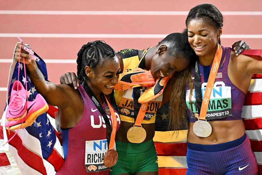 Sha'Carri Richardson, Shericka Jackson and Gabrielle Thomas pose for a picture after the women's 200m final