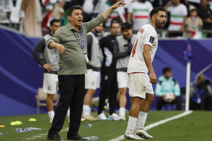 Iran coach Amir Ghalenoei on the sidelines against Japan